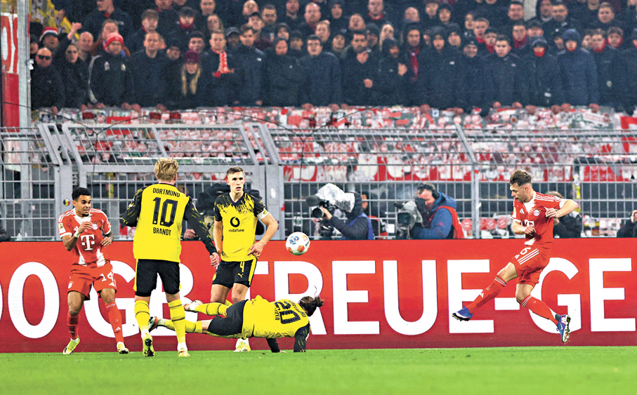 ●甘美治（右）射入致勝入球。  路透社