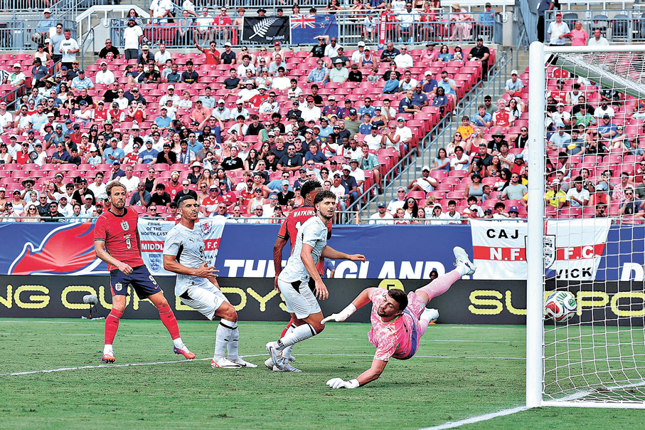 ●卡尼（左一）替英格蘭奠勝。  法新社